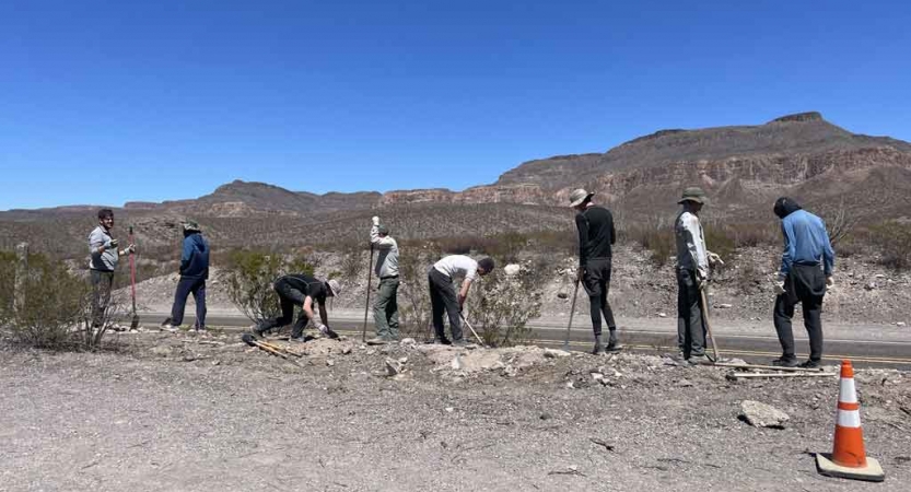 a group of students participate in a service project in texas